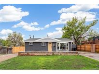 Charming brick home featuring a well-maintained lawn, complemented by a spacious front yard and a cozy front porch at 3540 E 91St Ave, Thornton, CO 80229