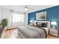 Spacious bedroom with hardwood floors and large windows at 1375 N Williams St # 204, Denver, CO 80218