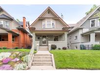 Charming two-story home with a front porch and beautifully landscaped yard at 506 N Marion St, Denver, CO 80218