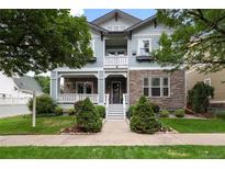 Charming two-story home with stone accents, covered porch, and well-maintained landscaping at 11702 Perry St, Westminster, CO 80031