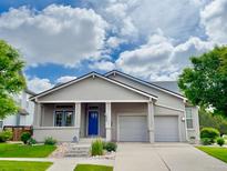 Charming single-story home featuring a covered porch, well-kept landscaping, and a two-car garage at 1688 Aquamarine Dr, Brighton, CO 80603