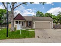 Charming single-story home with a well-maintained lawn and a two-car attached garage at 12665 Grove Ct, Broomfield, CO 80020
