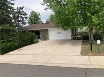 Charming single-story home with a spacious driveway and a well-maintained front yard at 14751 E 24Th Ave, Aurora, CO 80011