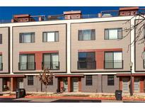 Modern townhome featuring a contemporary design with multi-tone siding and private balconies at 2350 Tremont Pl # 19, Denver, CO 80205
