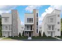 Modern townhomes with sleek design, featuring mixed materials, windows, and professional landscaping at 1218 Dylan Dr, Erie, CO 80026