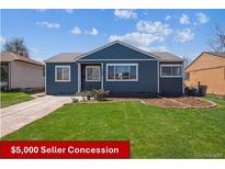 Charming single-story home with a well-maintained lawn and a classic blue exterior at 2285 Fulton St, Aurora, CO 80010