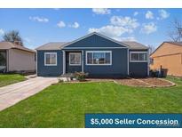 Charming single-story home featuring a well-maintained lawn and inviting curb appeal at 2285 Fulton St, Aurora, CO 80010