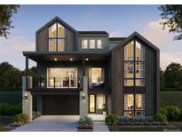Two-story modern home with dark siding, large windows, and attached garage at 11490 Alla Breve Cir, Lone Tree, CO 80134