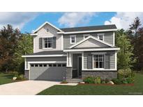 Charming two-story home with gray siding, a two-car garage, and a beautifully landscaped front yard at 4455 Boone Cir, Brighton, CO 80601