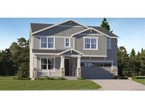 Two-story house with gray siding, stone accents, and a two-car garage at 545 Twilight St, Erie, CO 80516