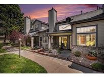Charming townhouse exterior with manicured landscaping and private entrance under a colorful sunset sky at 4301 S Pierce St # 4D, Littleton, CO 80123