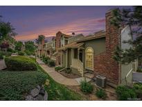 Charming townhomes feature private entrances, brick accents and lush landscaping at 1915 S Hannibal St # G, Aurora, CO 80013