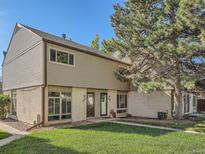 Charming townhome with a well-maintained lawn and appealing exterior features at 4273 W Ponds Cir, Littleton, CO 80123