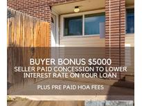 Home exterior including a brick accent and $5000 seller bonus at 8019 Wolff St # A, Westminster, CO 80031