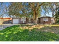Charming single-story home with mature landscaping and a well-maintained front yard at 2580 Valley View Dr, Denver, CO 80221