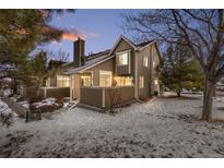 Charming townhome exterior with snowy front yard and landscaping at 6809 Zenobia St # 4, Westminster, CO 80030