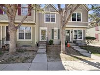 Charming townhome with a well-maintained front exterior and inviting entrance at 1811 S Quebec Way # 60, Denver, CO 80231