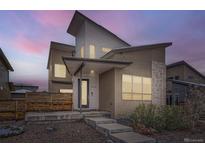 Modern two-story home with unique architecture, contemporary color palette and stylish front entry at 9715 Taylor River Cir, Littleton, CO 80125