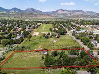Expansive property featuring lush land and mountain views, outlined in red at 12196 W Belleview Dr, Littleton, CO 80127