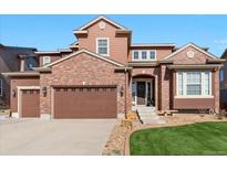 Beautiful two-story home with attached garage and well-manicured lawn at 3745 Spanish Oaks Trl, Castle Rock, CO 80108