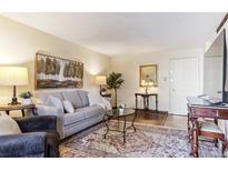 Comfortable living room with neutral tones, plush seating, and decor at 2375 S Linden Ct # 118, Denver, CO 80222
