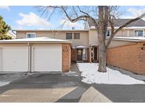 Charming townhome featuring a one car garage and a brick entryway at 1892 Centaur Cir, Lafayette, CO 80026
