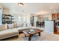 Spacious living area connecting the kitchen, dining space, and living room for easy entertaining at 13151 Grant N Cir # C, Thornton, CO 80241