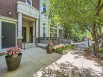 Inviting front porch with decorative planters and a well-maintained entryway at 30 Garfield St # B, Denver, CO 80206