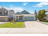 Charming single-Gathering home with a well-manicured lawn and inviting front porch at 7647 Elmwood St, Littleton, CO 80125