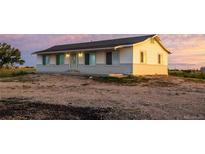 Charming single-story home with fresh paint and a well-maintained yard at 69101 E 72Nd Ave, Byers, CO 80103