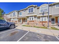 Charming townhome with brick accents and visitor parking, perfect for guests at 9126 Gale Blvd # 2, Thornton, CO 80260