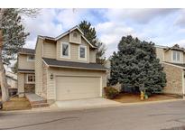 Inviting two-story home with a neutral exterior, attached garage, and well-maintained landscaping at 4605 S Yosemite St # 39, Denver, CO 80237