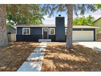 Charming single-story home featuring a modern exterior, landscaped yard, and attached garage at 2616 W 134Th Cir, Broomfield, CO 80020