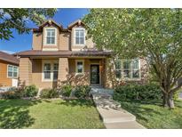 Charming two-story home with a well-manicured lawn and beautiful landscaping at 14200 Lakeview Ln, Broomfield, CO 80023