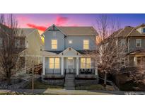 Charming two-story home with stone accents and a covered front porch, perfect for enjoying the outdoors at 3473 Ulster St, Denver, CO 80238
