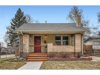 Charming front porch with brick pillars and wooden steps, a welcoming entrance to the home at 2901 Ames St, Wheat Ridge, CO 80214