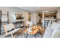 Inviting living room with open layout, stylish furnishings, and modern decor at 1008 N Corona St # 205, Denver, CO 80218