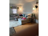 Cozy living room features a comfortable sectional sofa and a plush area rug at 1901 Clear Creek Dr # A-104, Georgetown, CO 80444