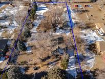 Aerial view of house and large lot, offering ample space at 1165 Garrison St, Lakewood, CO 80215