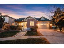 Brick ranch home with attached garage and landscaped yard at 24558 E Louisiana Cir, Aurora, CO 80018