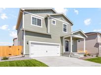 Charming two-story home with a spacious two-car garage and a welcoming front porch at 7303 Dolores Ave, Frederick, CO 80530