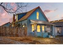 Charming blue brick home with a classic design and a welcoming front porch at 4743 Tejon St, Denver, CO 80211