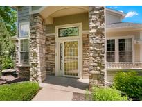 Inviting front entrance featuring stone accents and a decorative glass door at 5155 W Quincy Ave # L101, Denver, CO 80236