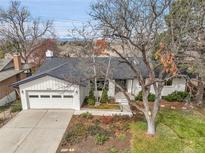 Charming single-story home with a well-maintained lawn and a two-car garage at 2961 S Rosemary St, Denver, CO 80231
