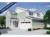 Charming two-story home featuring a neutral color palette, attached two car garage, and professionally designed landscaping at 22361 E 38Th Pl, Aurora, CO 80019