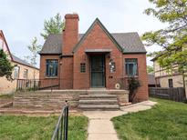 Charming brick home featuring a well-manicured front yard and inviting entryway at 2710 Stuart St, Denver, CO 80212