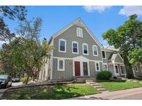 Charming two-story home with landscaped front yard, beautiful windows and inviting red front door at 2239 S Jasper Way # A, Aurora, CO 80013