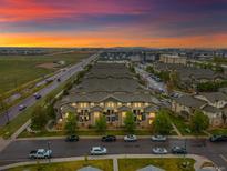 Stunning aerial view of townhome community featuring lush landscaping and convenient parking at 5800 Tower Rd # 610, Denver, CO 80249
