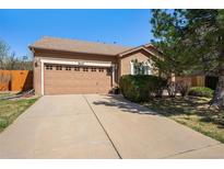 Charming single-story home featuring an attached two-car garage and well-maintained landscaping at 20137 E Prentice Pl, Centennial, CO 80015