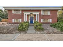 Brick building with entryway and landscaping at 450 W Jefferson Ave, Englewood, CO 80110